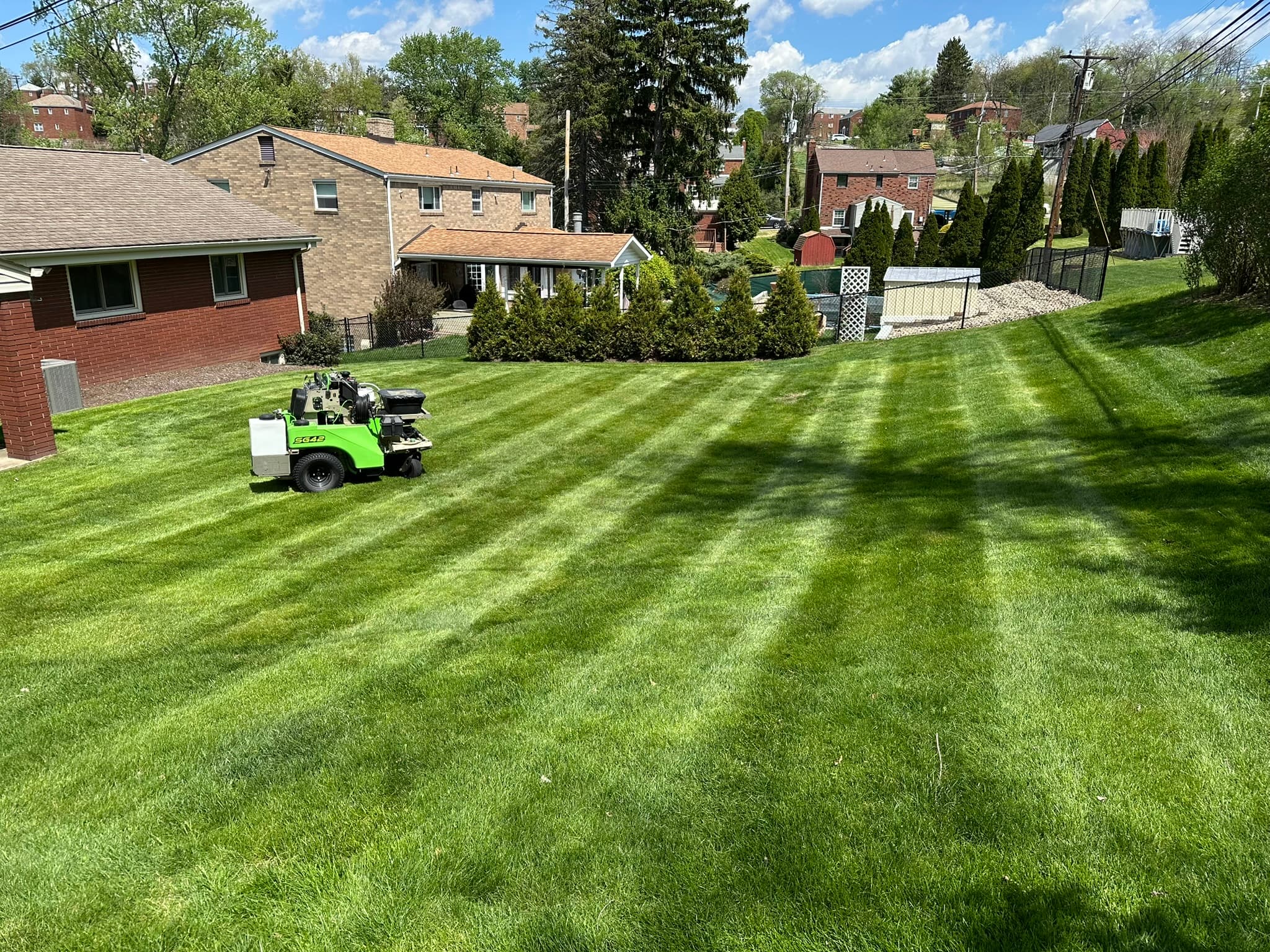 Weekly mowing and edging results at residential property