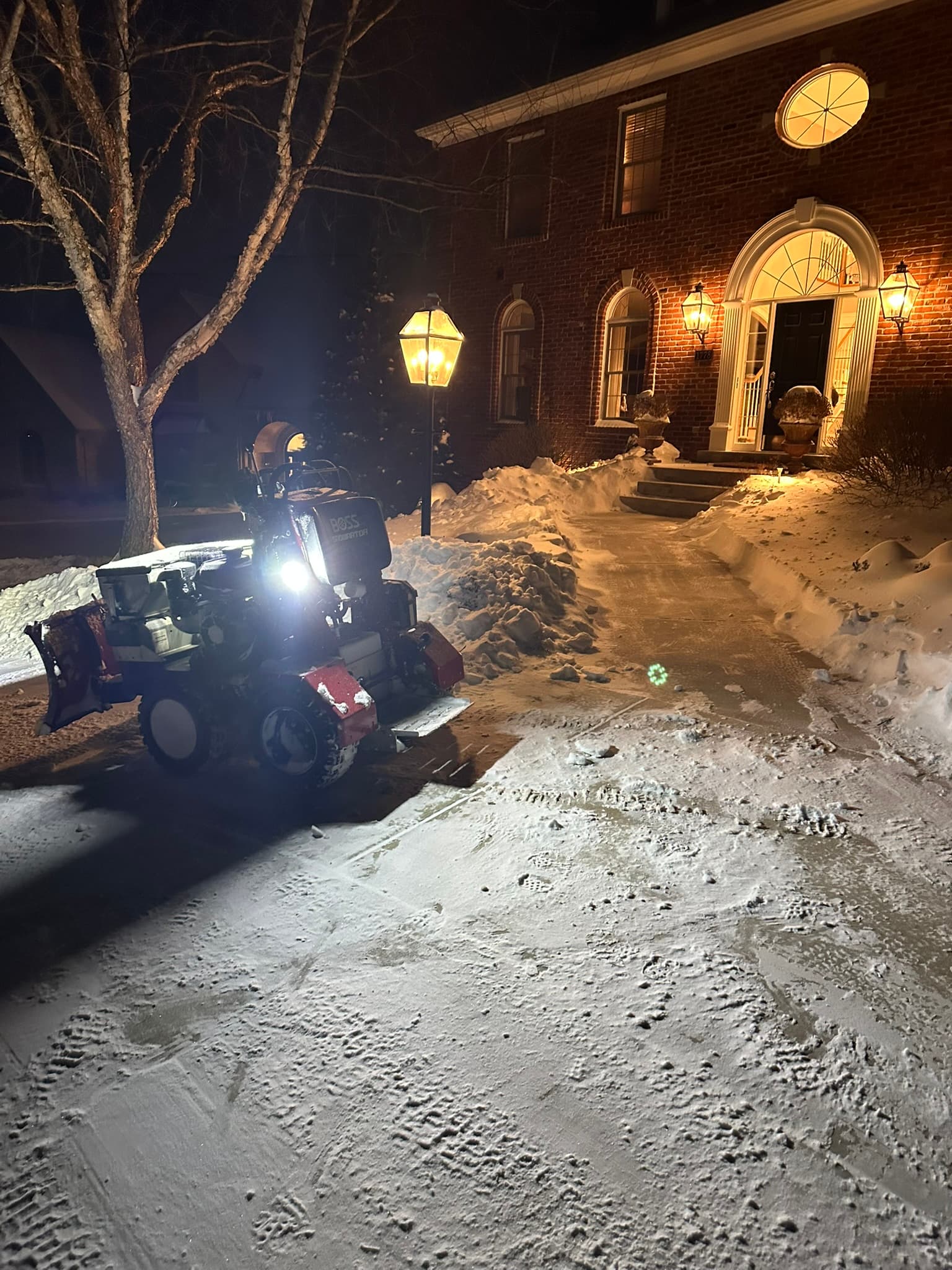 Residential driveway cleared during snow removal service